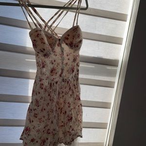 Mini floral dress with tulle, medium but runs small. has cups inside dress